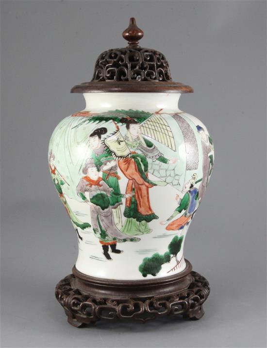 A Chinese famille verte baluster jar, wood cover and stand, 19th century, Kangxi mark, total height including cover and stand, 34cm